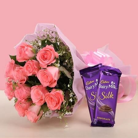 pink roses bunch with chocolates