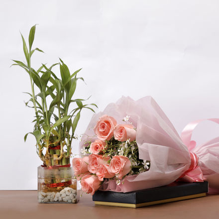 Bunch of pink roses with bamboo plant