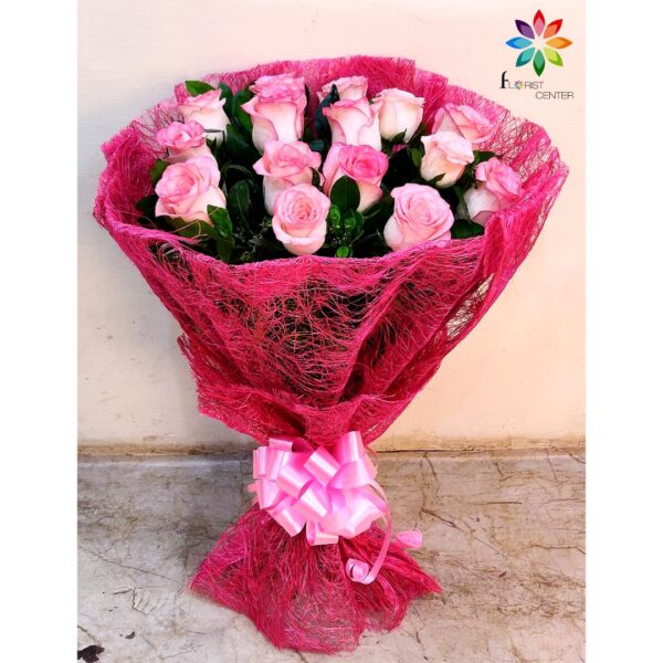 Pink roses bouquet in jute packing