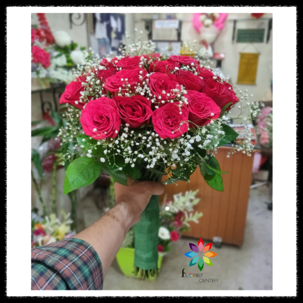 Hand bouquet made with red roses